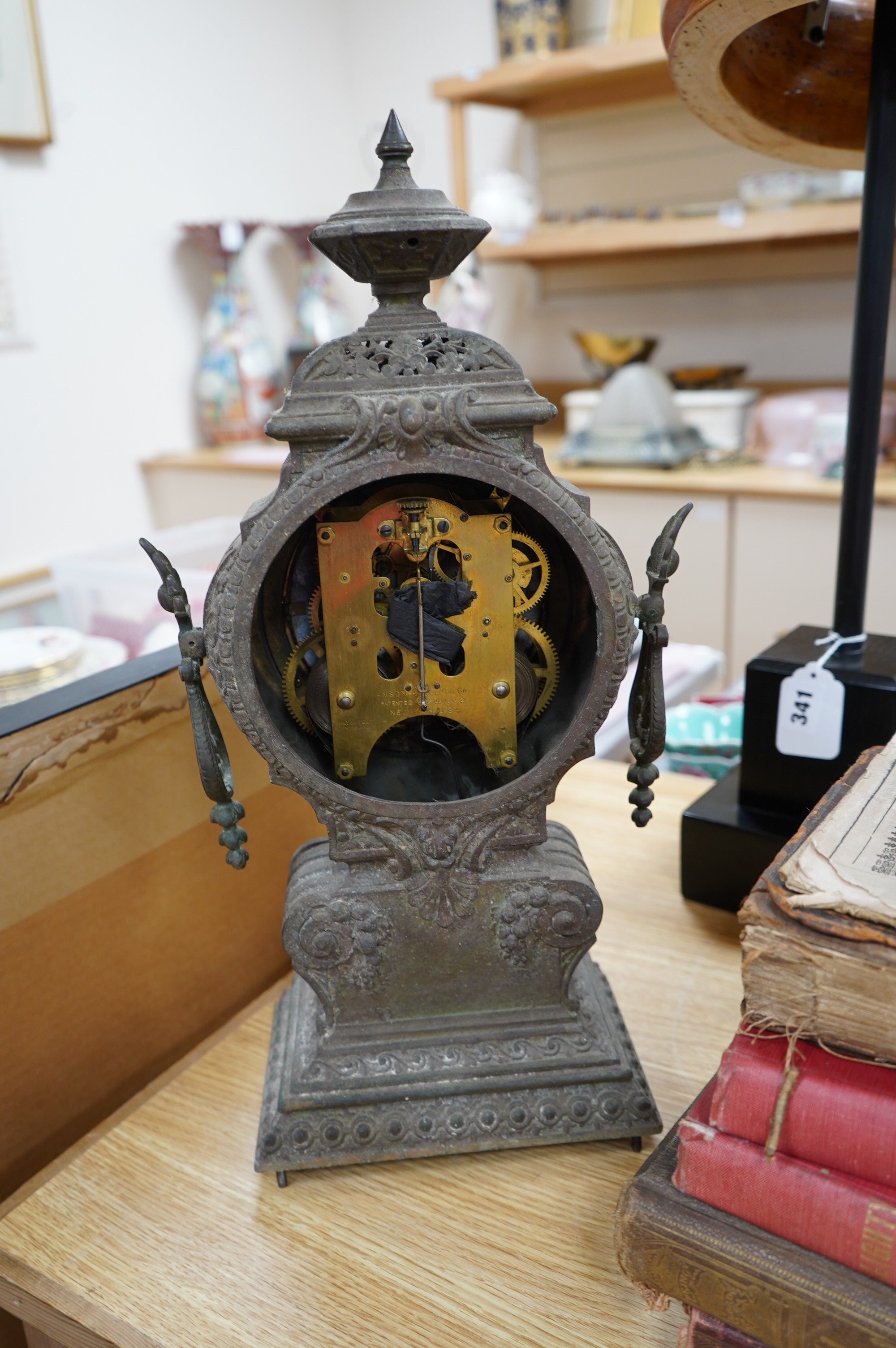 A spelter clock with enamel Arabic dial, 47cm high. Condition - poor to fair, untested